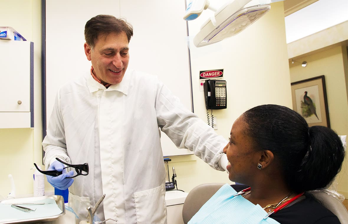 Dr. Carpinito talking with a female patient Dr. Carpinito talking with a female patient